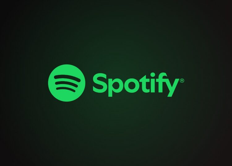 Spotify logo with green circle and sound waves beside the wordmark on a dark green-black gradient background