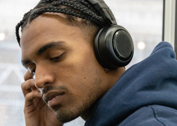 TDM. Neo headphones worn in speaker-to-headphone twist design