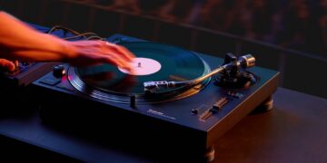 Technics SL-1210MKX professional direct-drive DJ turntable in a club environment