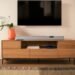 Teufel Cinebar Pro 2 soundbar and subwoofer set below a wall-mounted TV