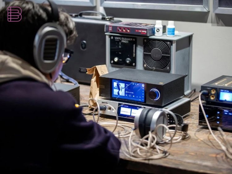 Close-up of a headphone demo station with amplifier and DAC at the Vancouver Headphone Festival